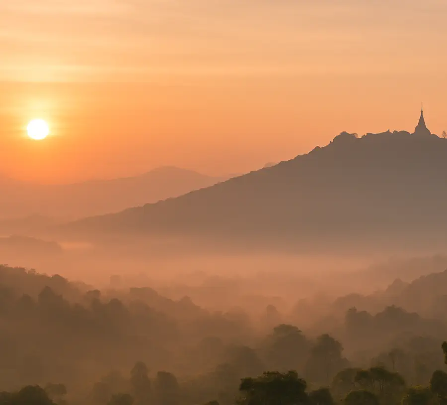 Doi Suthep at sunrise overlooking the mountains of Chiang Mai, symbolizing peace, healing, and natural calm